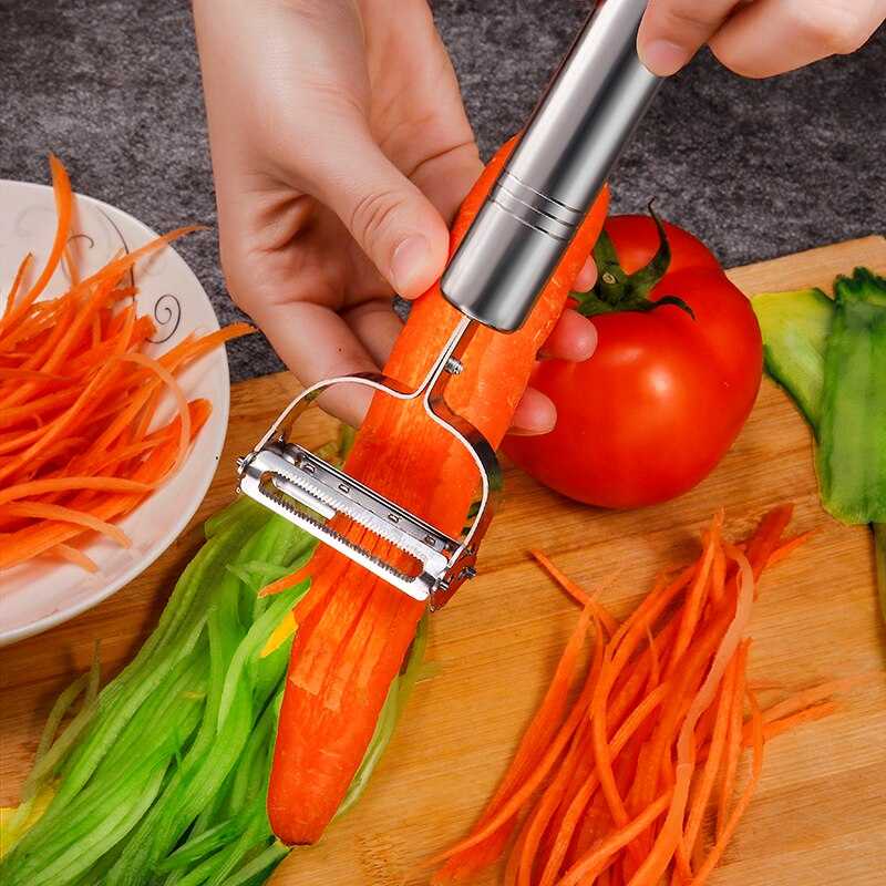 Areeb Mart stainless steel julienne vegetable peeler with ergonomic handle for peeling and julienning vegetables in kitchen tools.